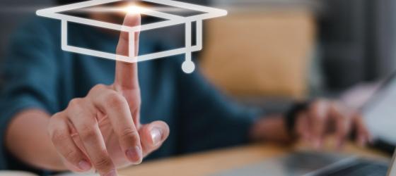 a woman's hand clicks on an imaginary screen on the stylized image of a graduation touch